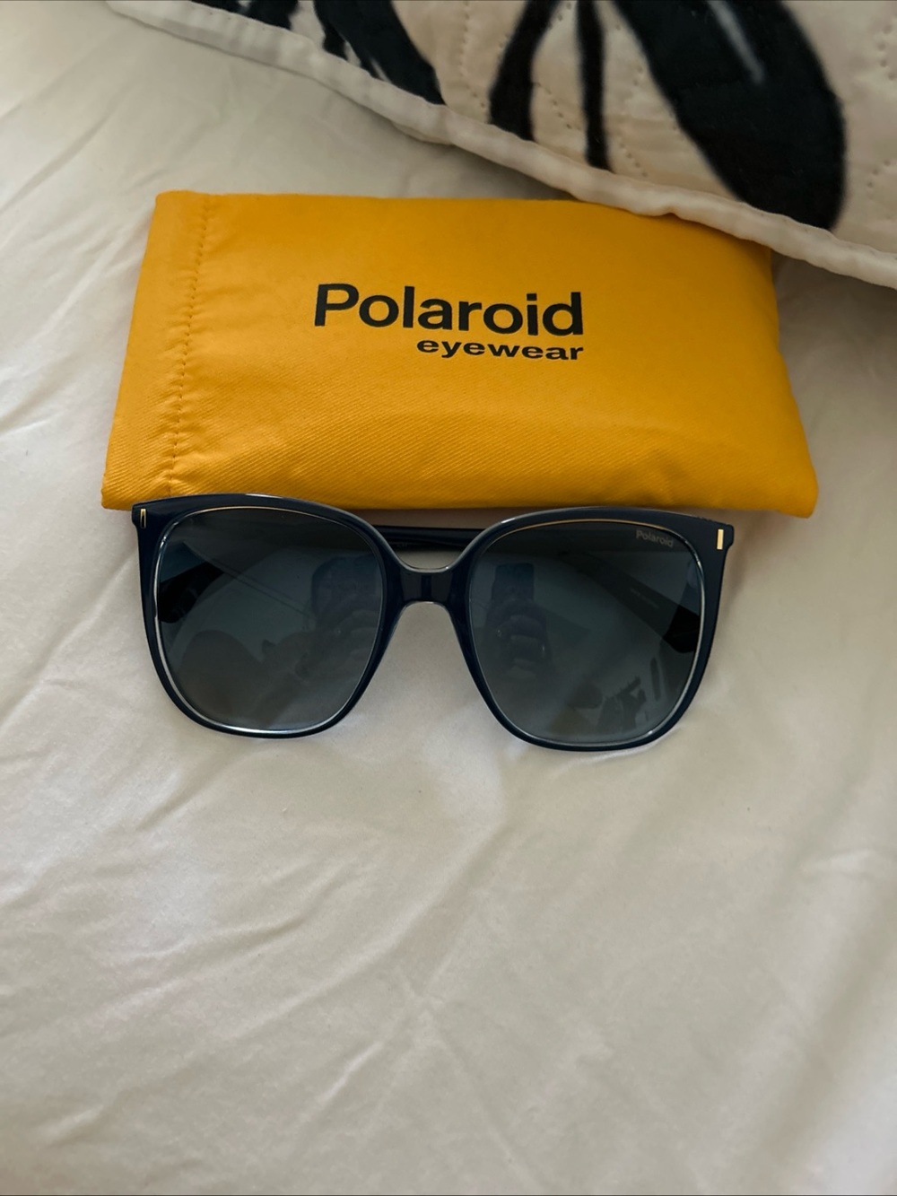 Polaroid Women's Navy Frame Sunglasses with Dark Lenses and blue frame